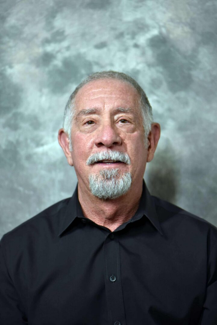 Portrait of older man with white goatee. LARRY SOBEL, M.D., M.P.H. | Medical Family Practitioner, Phoenix